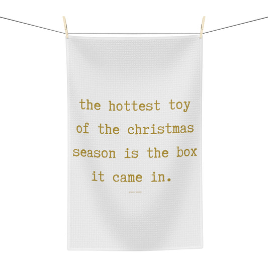 the hottest toy is the box it came in.-gianna jessen gold font tea towel